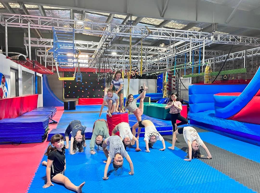 School group participating in a coached obstacle session